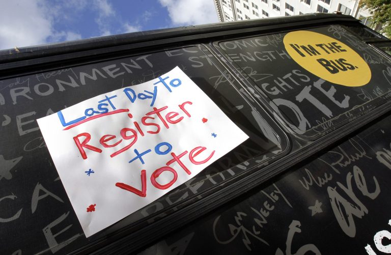 The American Civil Liberties Union and nearly two dozen other groups are asking the administration to include a feature on healthcare.gov that allows Americans shopping to health plans to register to vote. (AP Photo)