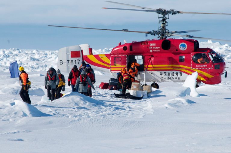 A Chinese helicopter arrives to rescue some of the 52 passengers trapped for more than a week on the icebound Russian research ship MV Akademik Shokalskiyin on Thursday. (AP/AustralasianÃÂ AntarcticÃÂ Expedition)