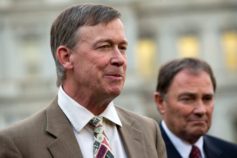 Colorado Gov. John Hickenlooper, left, speaks to the media after meeting with President Obama at the White House on Tuesday. (AP Photo/Jacquelyn Martin)