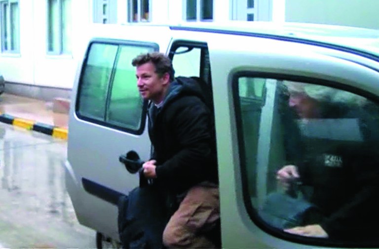In this image made from video, NBC chief foreign correspondent Richard Engel exits a car after crossing back into Turkey, after they were freed unharmed following a firefight at a checkpoint after five days of captivity inside Syria, in Cilvegozu, Turkey, Tuesday, Dec. 18, 2012. Engel told the Turkish news agency Anadolu that he and his colleagues are 