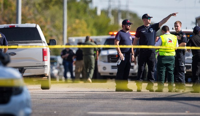 Law enforcement officials work the scene of a fatal shooting at the First Baptist Church in Sutherland Springs, Texas, on Sunday, Nov. 5, 2017. (Nick Wagner/Austin American-Statesman via AP)