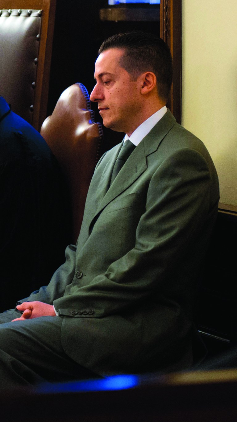 RETRANSMISSION TO PROVIDE ALTERNATIVE CROP - In this photo released by the Vatican paper L'Osservatore Romano, pope's butler Paolo Gabriele sits in the wood-trimmed courtroom of the Vatican tribunal, at the Vatican, Saturday, Sept. 29, 2012. The Vatican opened the public trial Saturday of the pope's butler for allegedly stealing and leaking papal correspondence to a journalist, the most embarrassing scandal of Pope Benedict XVI's papacy. Paolo Gabriele, a 46-year-old father of three, faces up to four years in prison if he is convicted of aggravated theft in the worst security breach in the Vatican's recent history. He has already confessed, saying he acted to shed light on what he called 