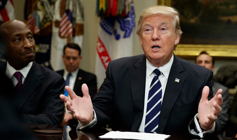 Merck CEO Kenneth Frazier listens as President Trump speaks during a meeting with pharmaceutical industry leaders. 