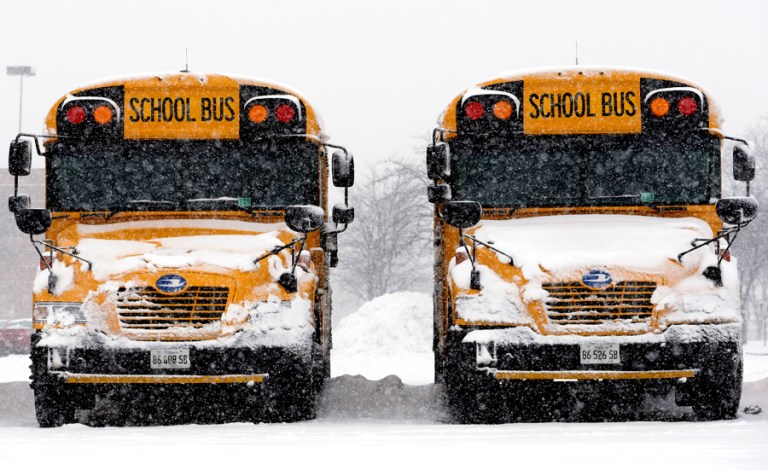 When some students brave the weather on snowy days and others stay home, it disrupts learning. (AP file photo/Nam Y. Huh)