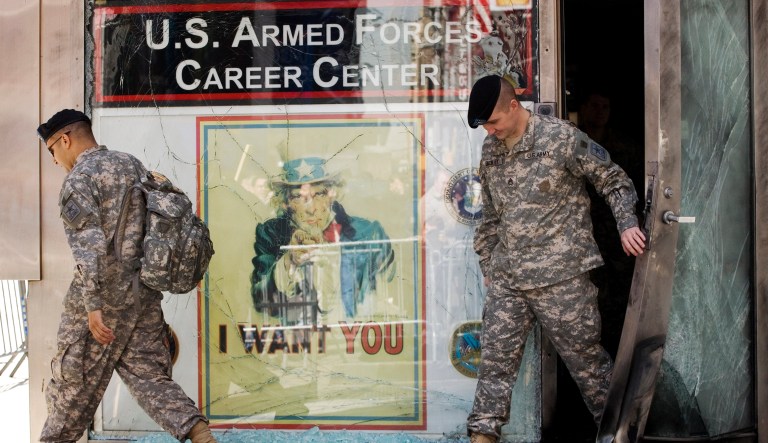 Unfortunately, too many high school graduates who seek the opportunity to serve don't make the cut. (AP Photo/Mark Lennihan)