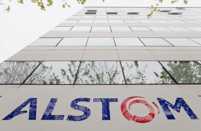 A view of the company logo Alstom at the headquarters of the leading global maker of high-speed trains, power plants and grids, outside Paris, France, Thursday, April 24, 2014.  Shares in French train and equipment manufacturer Alstom have  climbed more than 12 percent in early Paris trading on reports that General Electric Co. is considering buying it, but Alstom released a statement that it would not comment until its annual earnings report scheduled for May 7.(AP Photo/Jacques Brinon)