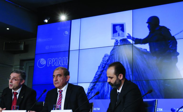 Syrian Deputy Prime Minister Qadri Jamil, center, and Minister for National Reconciliation Ali Haidar, left, speak during a news conference in Moscow, Tuesday Aug. 21, 2012. Unidentified man at right. (AP Photo/Sergey Ponomarev)