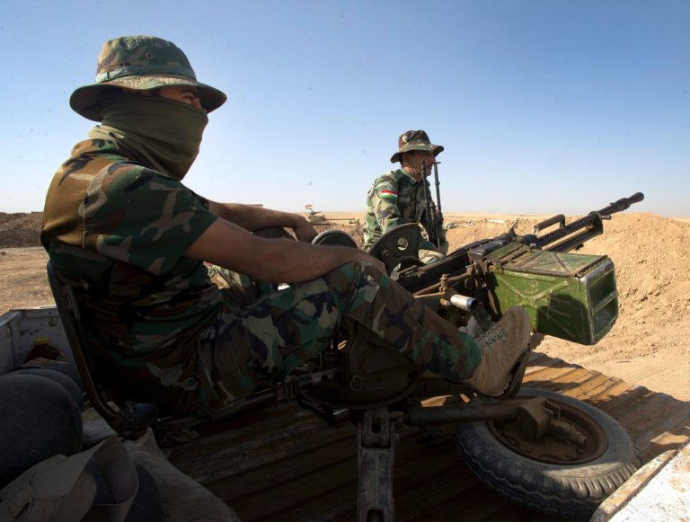 Peshmurga soldiers man their positions at the front line in the fight against the Islamic State group Thursday, Sept. 4, 2014 in Kalak, Iraq. More than three-quarters of Americans support military aid to forces currently fighting the Islamic State, according to a poll by CNN/ORC International. (AP Photo/The Canadian Press, Ryan Remiorz)