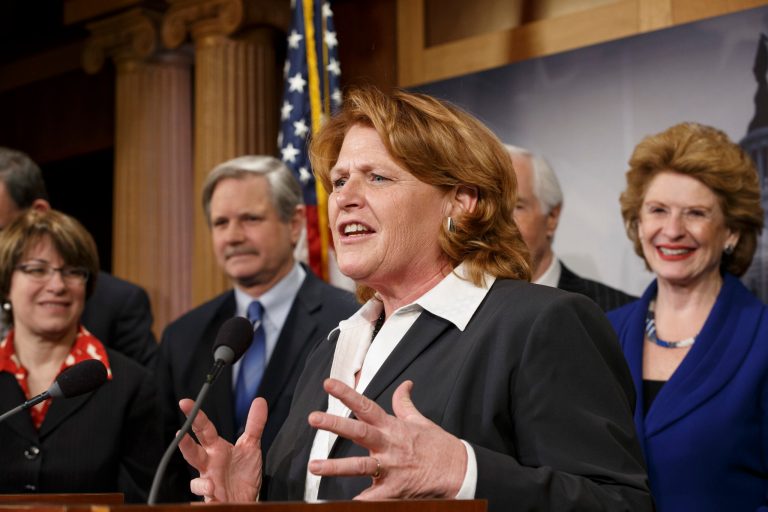 Senate Agriculture Committee member Sen. Heidi Heitkamp, D-N.D., center, joined by fellow committee members, gestures during a news conference on Capitol Hill in Washington, Tuesday, Feb. 4, 2014, after congressional approval of a sweeping five-year farm bill that provides food for the needy and subsidies for farmers. From left are, Sen. Amy Klobuchar, D-Minn., Sen. John Hoeven, R-N.D., Heitkamp, the committee's ranking member, Sen. Thad Cochran, R-Miss. and committee chair Sen. Debbie Stabenow, D-Mich.  (AP Photo/J. Scott Applewhite)
