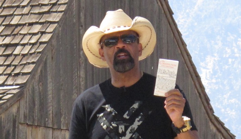 A report says former Milwaukee County Sheriff David A. Clarke Jr. will face trial on Jan. 22 to determine if his aggressive Facebook posts at a fellow airline passenger count as a threat. (AP Photo/Scott Sonner)