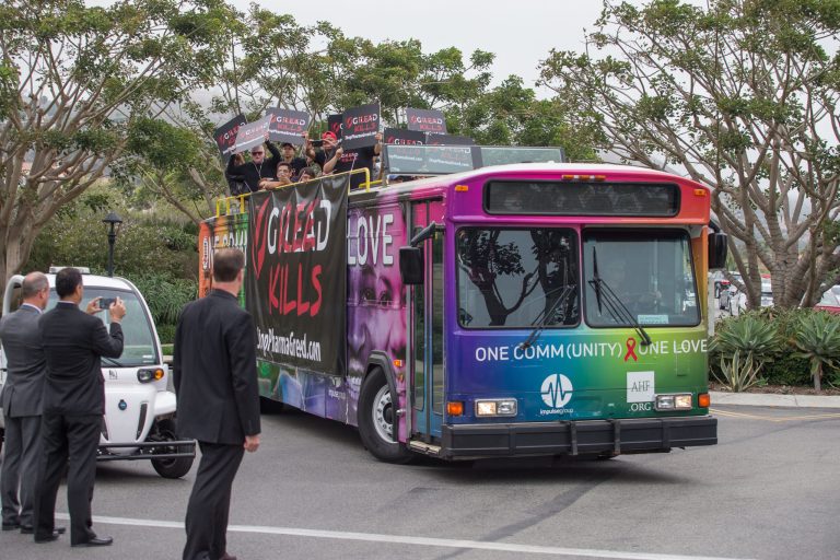 AIDS advocates participate in a rolling protest caravan in Rancho Palos Verdes, Calif., on June 8, targeting Gilead Sciences over its drug pricing and policies during the drug giant's presentation at Goldman Sachs' Annual Healthcare Conference at the exclusive Terranea Resort. The protest followed a Los Angeles Times article that revealed Gilead's patent manipulation in order to maximize profits on its drugs containing tenofovir, a key HIV/AIDS drug. (AIDS Healthcare Foundation via AP)
