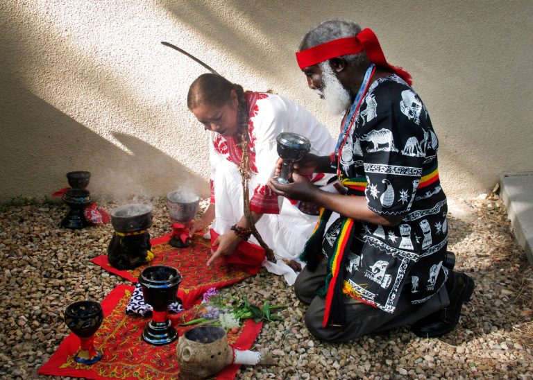 FILE - This July 22, 2013 file photo shows curanderos, or traditional healers, conducting a ceremony on the campus of the University of New Mexico in Albuquerque. The University of New Mexico is going to offer a free online class on curanderismo, the art of traditional healing. The school announced in May 2014 it will host the Massive Open Online Course as an offshoot of its popular curanderismo class offered on campus every summer.(AP Photo/Russell Contreras, file)