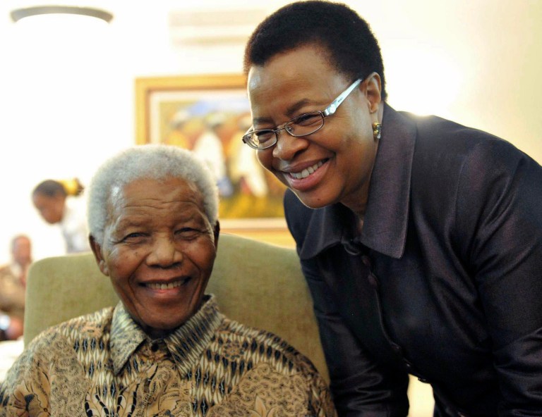   FILE This May 16, 2011 file photo supplied by the South African Government Communications and Information Services, GCIS, shows former South African President Nelson Mandela and his wife Graca Machel after they cast an early ballot in upcoming local elections at his home in Johannesburg, South Africa. South Africa's president has visited former leader Nelson Mandela in a hospital, and the presidency says Mandela continues to respond to treatment. The office of President Jacob Zuma says he saw Mandela on Saturday, Dec. 22, 2012, in Pretoria, the capital, and assured the anti-apartheid icon that he has the support of all South Africans and the world. Mandela, who is 94, has been hospitalized since Dec. 8. He was diagnosed with a lung infection and also had gallstone surgery. (AP Photo/Elmond Jiyane-GCIS, File)  