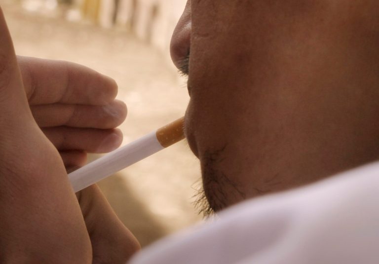 Man smokes a cigarette