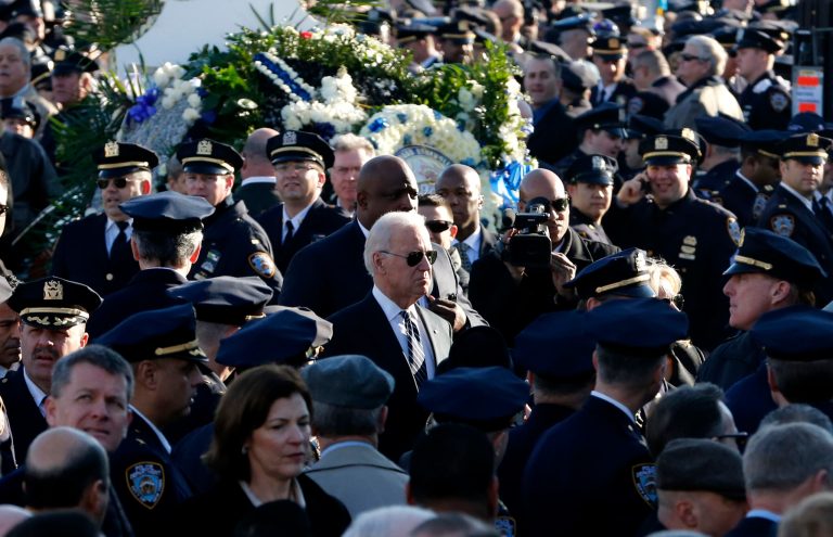 Vice President Joe Biden, center, arrives for funeral services for New York City police officer Rafael Ramos at Christ Tabernacle Church, in the Glendale section of Queens, Saturday, in New York. Ramos and his partner, officer Wenjian Liu, were killed Dec. 20 as they sat in their patrol car on a Brooklyn street. The shooter, Ismaaiyl Brinsley, later killed himself. (AP Photo/Julio Cortez)