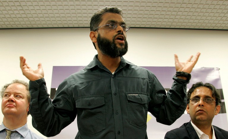 FILE - This is a  Saturday, Feb. 28, 2009  file photo of former Guatanamo detainee Moazzam Begg, who was released in 2005, as he speaks during a session of the Convention Modern Liberty at the Institute of Education in London. British prosecutors  Wednesday Oct. 1, 2014 dropped terrorism charges against a former Guantanamo Bay detainee Moazzam Begg who is a high-profile advocate for the rights of terror suspects.  Begg had been due to stand trial next week on seven counts relating to the war in Syria (AP Photo/Akira Suemori, File)