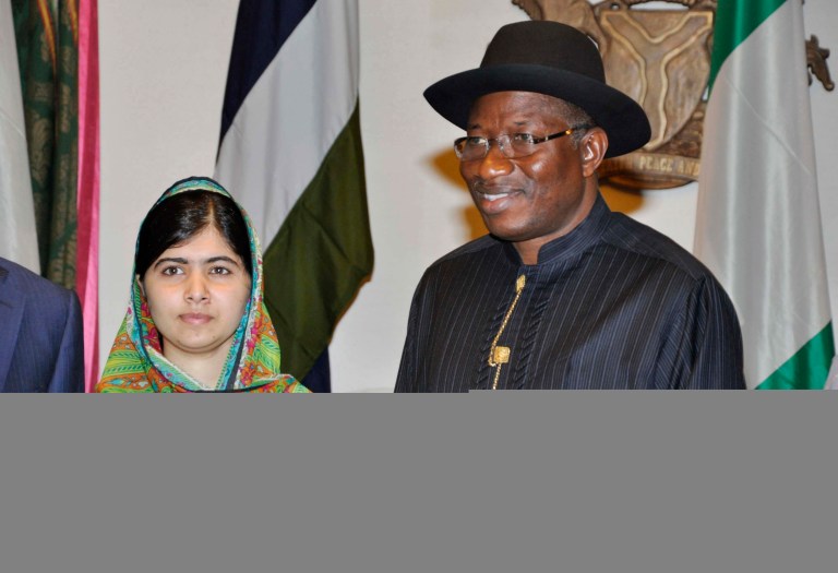 Pakistani activist Malala Yousafzai, left, poses for a photograph with Nigerian President, Goodluck Jonathan, right, at the Presidential villa, in Abuja, Nigeria, on Monday. (AP Photo)
