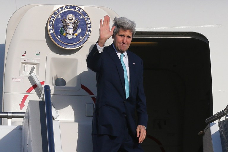 U.S. Secretary of State John Kerry waves to bid farewell in Sydney, Australia, Wednesday, Aug. 13, 2014. Kerry ended his vist in Australia for an annual Australia-United States Ministerial Consultations (AUSMIN) meeting. (AP Photo/Rob Griffith, Pool)