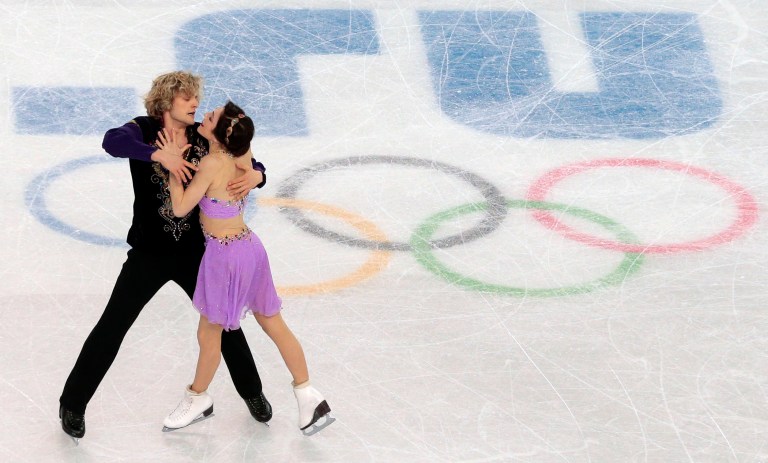 FILE - This Feb. 17, 2014 file photo shows Meryl Davis and Charlie White of the United States compete in the ice dance free dance figure skating finals during the 2014 Winter Olympics, in Sochi, Russia. Slightly more than half of the people who watched the Sochi Olympics on NBC also used a computer, tablet or smartphone to get information about the games while the TV was on, the network said on Wednesday, April 23. NBC and its cable networks televised 541 hours of Sochi action and made all Olympic competition available online. (AP Photo/Ivan Sekretarev, File)