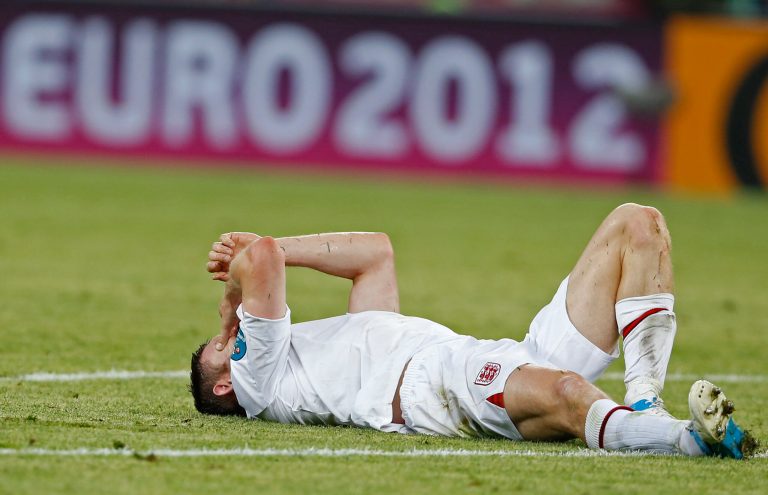   England's James Milner lies on the pitch during the Euro 2012 soccer championship Group D match between France and England in Donetsk, Ukraine, Monday, June 11, 2012. (AP Photo/Kirsty Wigglesworth)  
