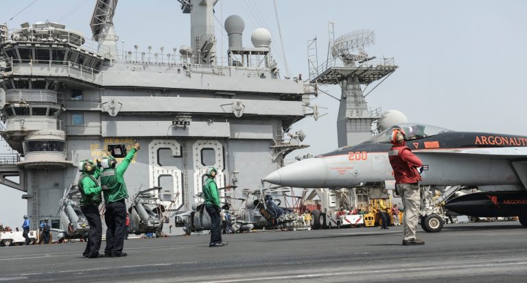 In this photo provided by the U.S. Navy, an F/A-18E Super Hornet assigned to the Argonauts of Strike Fighter Squadron (VFA) 147 prepares to launch from the flight deck of the aircraft carrier USS Nimitz in the Red Sea on Tuesday, Sept. 3, 2013.   The USS Truman arrived in the region to take the place of the USS Nimitz, which was supposed to head home. But the Navy ordered the Nimitz to stay for now. U.S. officials, however, have described the decision as prudent planning and have said it doesn't suggest the Nimitz would play a role in any possible strikes in Syria.  (AP Photo/U.S. Navy, MC3 Nathan R. McDonald, Released)