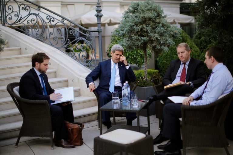 U.S. Secretary of State John Kerry, second left, and State Department Chief of Staff Jon Finer, left, meet with other members of the U.S. delegation at the garden of the Palais Coburg hotel where the Iran nuclear talks meetings are being held in Vienna, Austria, on Friday, July 10, 2015. (Carlos Barria/Pool via AP)