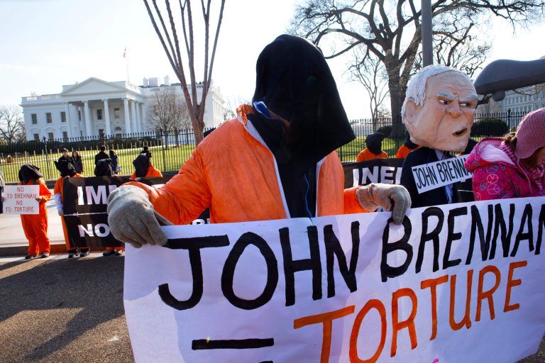 Demonstrators from the groups CodePink and Witness Against Torture protest President Obama's choice of then-Deputy National Security Adviser for Homeland Security and Counterterrorism John Brennan to head the CIA, Monday, Jan. 7, 2013, in front of the White House in Washington. (AP Photo/Jacquelyn Martin)