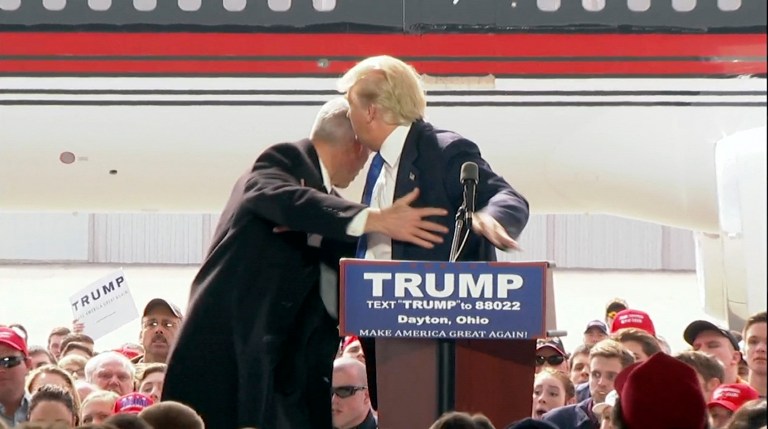 Donald Trump got a scare himself Saturday, ducking as Secret Service agents mounted the stage to protect him when a man tried to charge the stage. The man later said he hoped to show Trump is a bully. (TV Network Pool via AP)