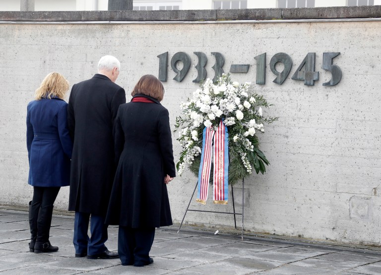 U.S. Vice President Mike Pence, center, his wife Karen, right, and his daughter Charlotte commemorate the victims of the Nazi terror during a visit to the former Nazi concentration camp in Dachau. (AP Photo/Matthias Schrader)