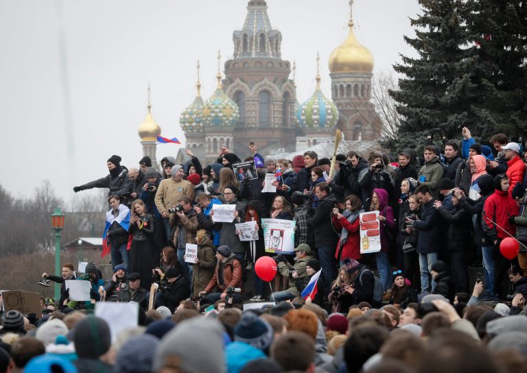 Protesters gather at Marsivo Field in St.Petersburg, Russia, Sunday, March 26, 2017. Thousands of people crowded in St.Petersburg on Sunday for an unsanctioned protest against the Russian government, the biggest gathering in a wave of nationwide protests that were the most extensive show of defiance in years. (AP Photo/Dmitri Lovetsky)