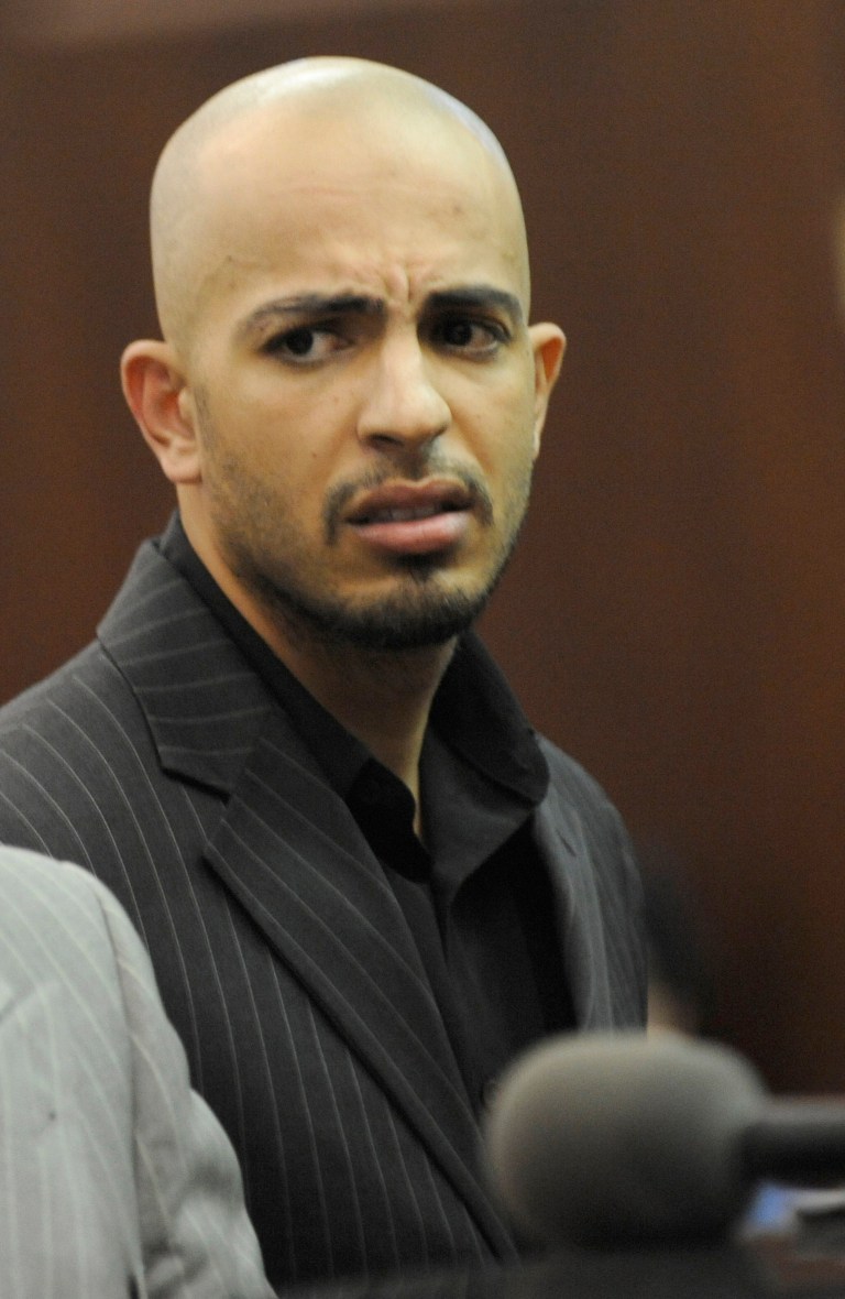   FILE - In this May 12, 2011 file photo, Ahmed Ferhani appears in a New York City courtroom for arraignment on state level terrorism charges. On Tuesday, Dec. 4, 2012, Ferhani pleaded guilty to charges that that he plotted to blow up city synagogues, saying he had wanted to âsend a message of intimidationâ to the city's Jewish community. (AP Photo/ Louis Lanzano, Pool)  