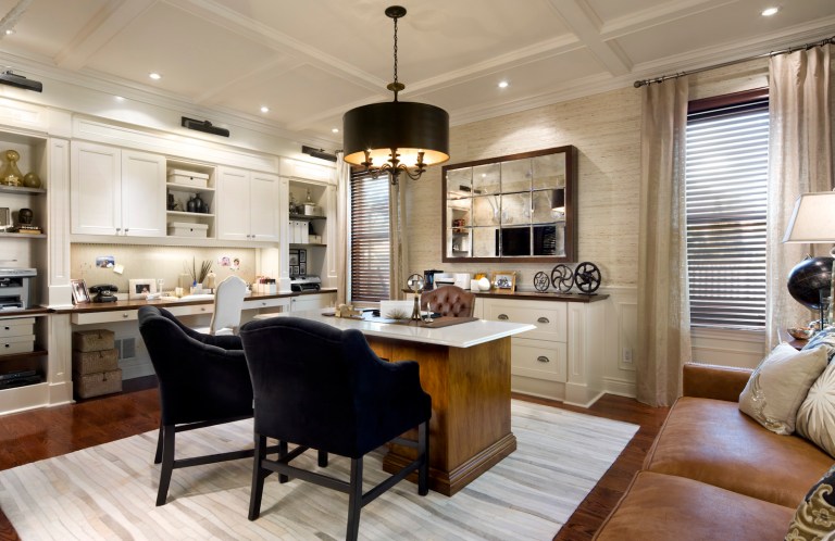 SH13D113CANDICETELLSALL April 15, 2013 -- With French doors, a new vinyl couch and other additions, this office space is now both practical and elegant. (SHNS file photo courtesy HGTV)