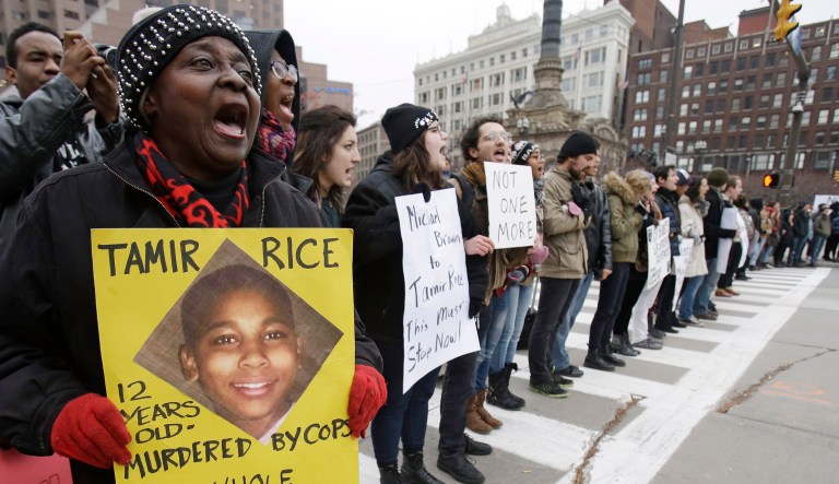 This Nov. 25, 2014, file photo, shows demonstrators blocking Public Square in Cleveland, during a protest over the police shooting of 12-year-old Tamir Rice. Police Chief Calvin Williams announced the discipline against officers Timothy Loehmann and Frank Garmback, who were involved in the fatal shooting of the boy at a recreation center as he held a pellet gun. (AP Photo/Tony Dejak, File)