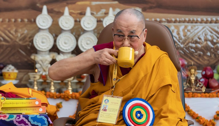 Tibetan spiritual leader the Dalai Lama drinks tea during an event at the Kirti Monastery in Dharmsala, India, Saturday, Dec. 7, 2019. Tibetan spiritual leader the Dalai Lama presided over a function marking the 25th founding anniversary of the monastery in exile.