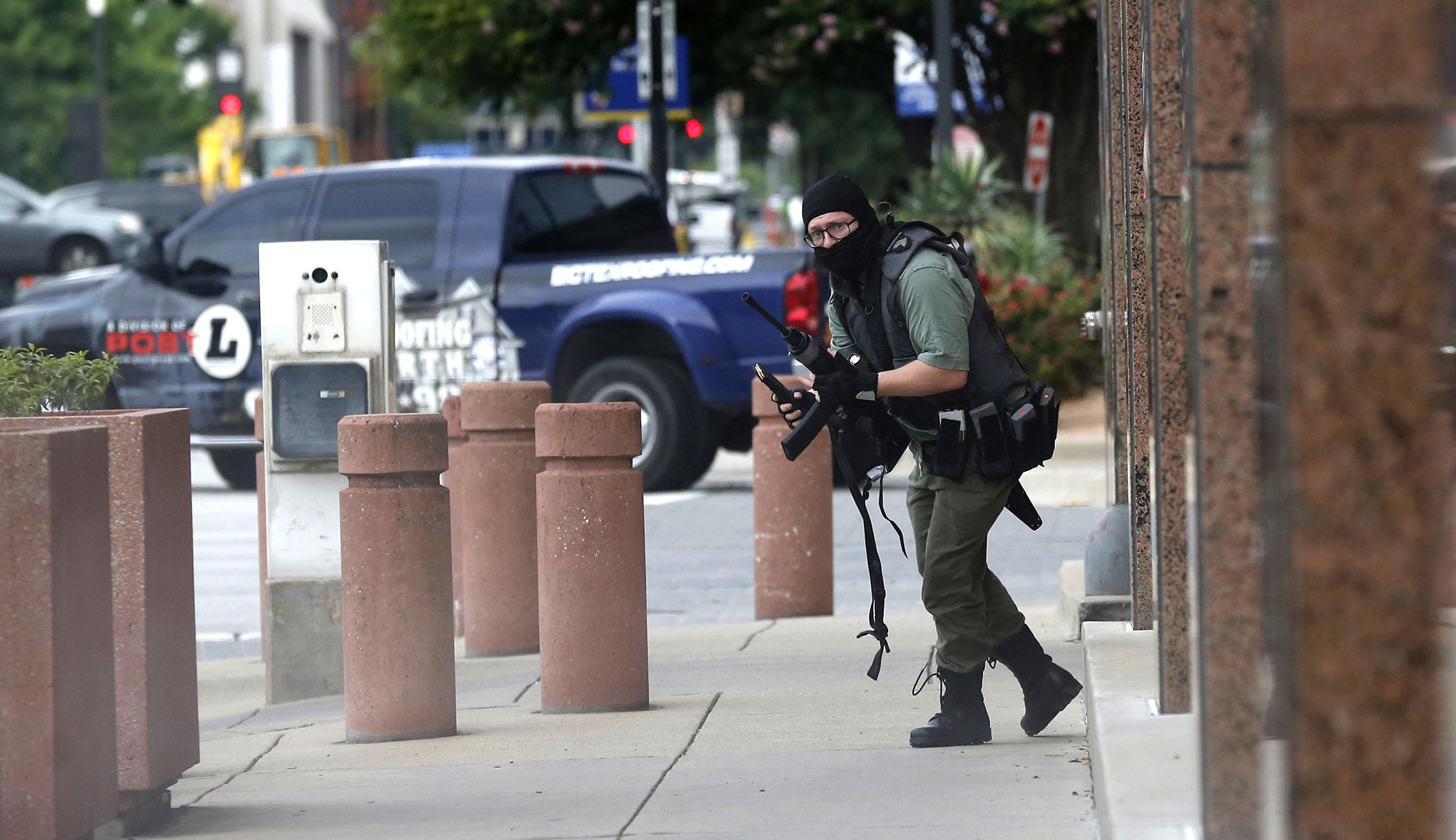 ‘He’s going to shoot’: Photographer tells of moment he came face to face with Dallas gunman