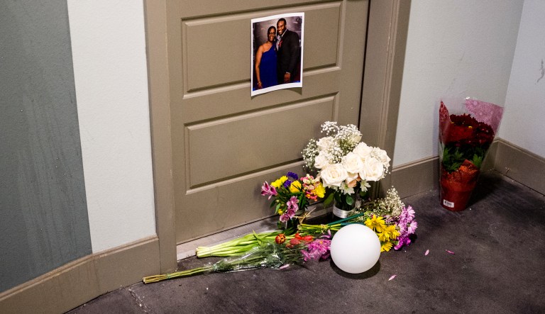 Flowers are placed at the front door of Botham Jean's apartment on Monday, Sept. 10, 2018 in Dallas. Jean was shot Thursday by off-duty Dallas police officer Amber Guyger, who says she mistook his apartment for hers.