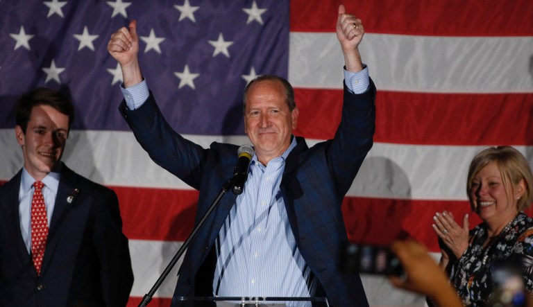 North Carolina 9th district Republican congressional candidate Dan Bishop celebrates his victory in Monroe, N.C., Tuesday, Sept. 10, 2019 with his son Jack, left, and wife Jo.