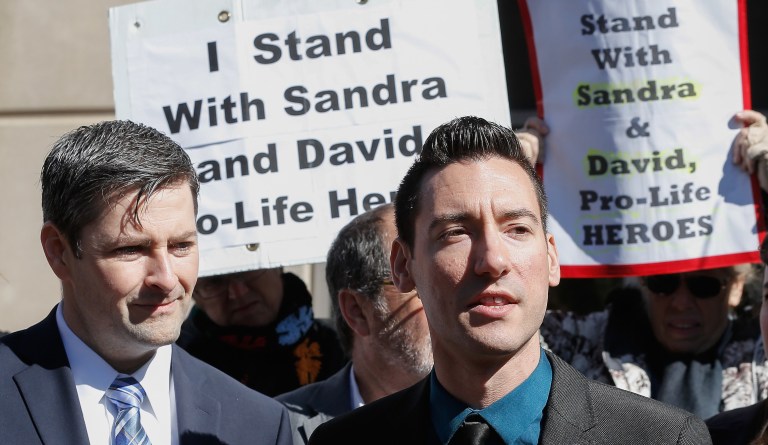David Daleiden, one of the two anti-abortion activists indicted last week, speaks to supporters outside the Harris County Criminal Courthouse  after turning himself in to authorities Thursday, Feb. 4, 2016, in Houston. Daleiden and Sandra Merritt are charged with tampering with a governmental record, a felony punishable by up to 20 years in prison.