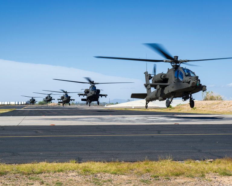 Boeing AH-64E Apache Longbow helicopters are among the items funded in the short-term spending measure expected to pass this week. (Army photo)