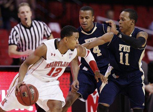 Maryland guard Terrell Stoglin, left, drives past Florida International guard DeJuan Wright, center, and guard Phil Taylor in the first half of an NCAA college basketball game in College Park, Md., Wednesday, Dec. 14, 2011.