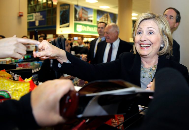 Former U.S. Secretary of State Hillary Rodham Clinton, right, smiles as she talks with supporters at a Barnes & Noble bookstore in Chicago, Wednesday, Oct. 8, 2014. Clinton visited Chicago for two appearances, including a speech to a business group, and to stump for Illinois Gov. Pat Quinn in his bid for re-election. (AP Photo/ Nam Y. Huh)