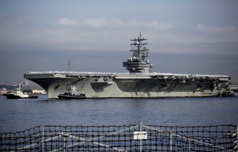 U.S. navy nuclear-powered aircraft carrier USS Ronald Reagan arrives at the U.S. Navy's Yokosuka base in Yokosuka, near Tokyo Thursday, Oct. 1, 2015. (AP Photo/Eugene Hoshiko)