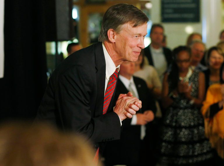 Colorado Gov. John Hickenlooper bows to his supporters at an election night gathering in Union Station in downtown Denver on Tuesday, Nov. 4, 2014. (AP Photo/David Zalubowski)