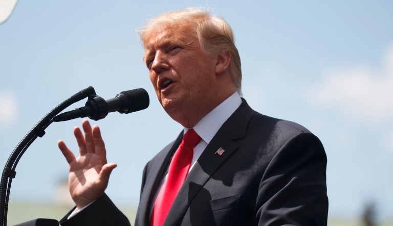 It will not be the first time Trump takes off for foreign travel with troubles lingering at home. (AP Photo/Evan Vucci)