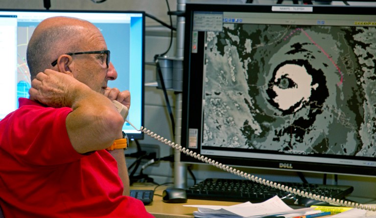 After weakening to a Category 3 after slamming Cuba, the storm, which devastated several islands in the Caribbean, re-energized over warmer waters overnight as it made its way north to Florida. (AP Photo/Andy Newman)