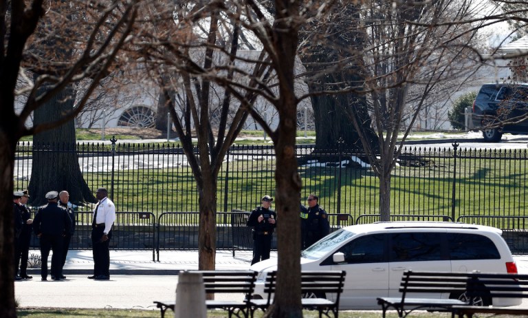 US Secret Service officers stand in the cordoned off area on Pennsylvania Avenue after a security incident near the fence of the White House. (AP Photo/Alex Brandon)