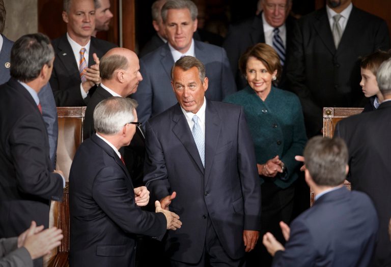 House Speaker John Boehner is greeted by members of the House as Republicans assume full control of Congress for the first time in eight years. (AP Photo/J. Scott Applewhite)