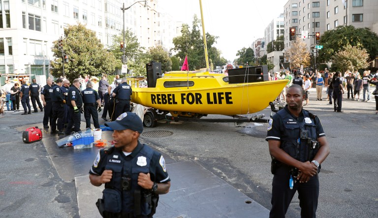 Protesters block the intersection of K and 16th Street NW, near the White House in Washington, Monday, Sept. 23, 2019. A broad coalition of climate and social justice organizations are disrupting the morning rush hour commute.