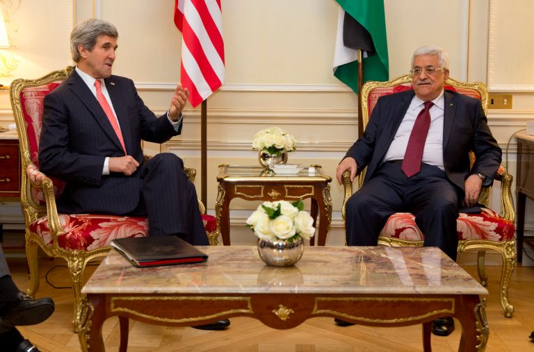 US Secretary of State John Kerry, left, meets with Palestinian President Mahmoud Abbas about ongoing peace talks with Israel on Wednesday, Feb. 19, 2014, in Paris.  U.S. Secretary of State John Kerry is in Paris for talks aimed at reaching agreement on a framework for an Israeli-Palestinian peace deal.  Kerry met Wednesday with Jordanian Foreign Minister Nasser Judeh and Palestinian President Mahmoud Abbas, with the aim of working to define the framework for negotiators as they seek to forge a comprehensive settlement to the conflict. (AP Photo/ Evan Vucci, Pool)