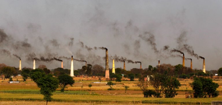 Smoke emits from the chimneys of numerous brick kilns on the outskirts of New Delhi, India, Tuesday, Sept. 23, 2014.Â India could announce its carbon emissions targets in the coming days. (AP Photo/Altaf Qadri)